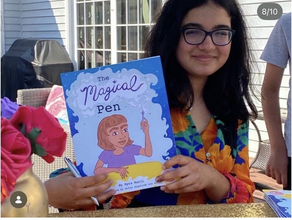 Myra holding The Magical Pen